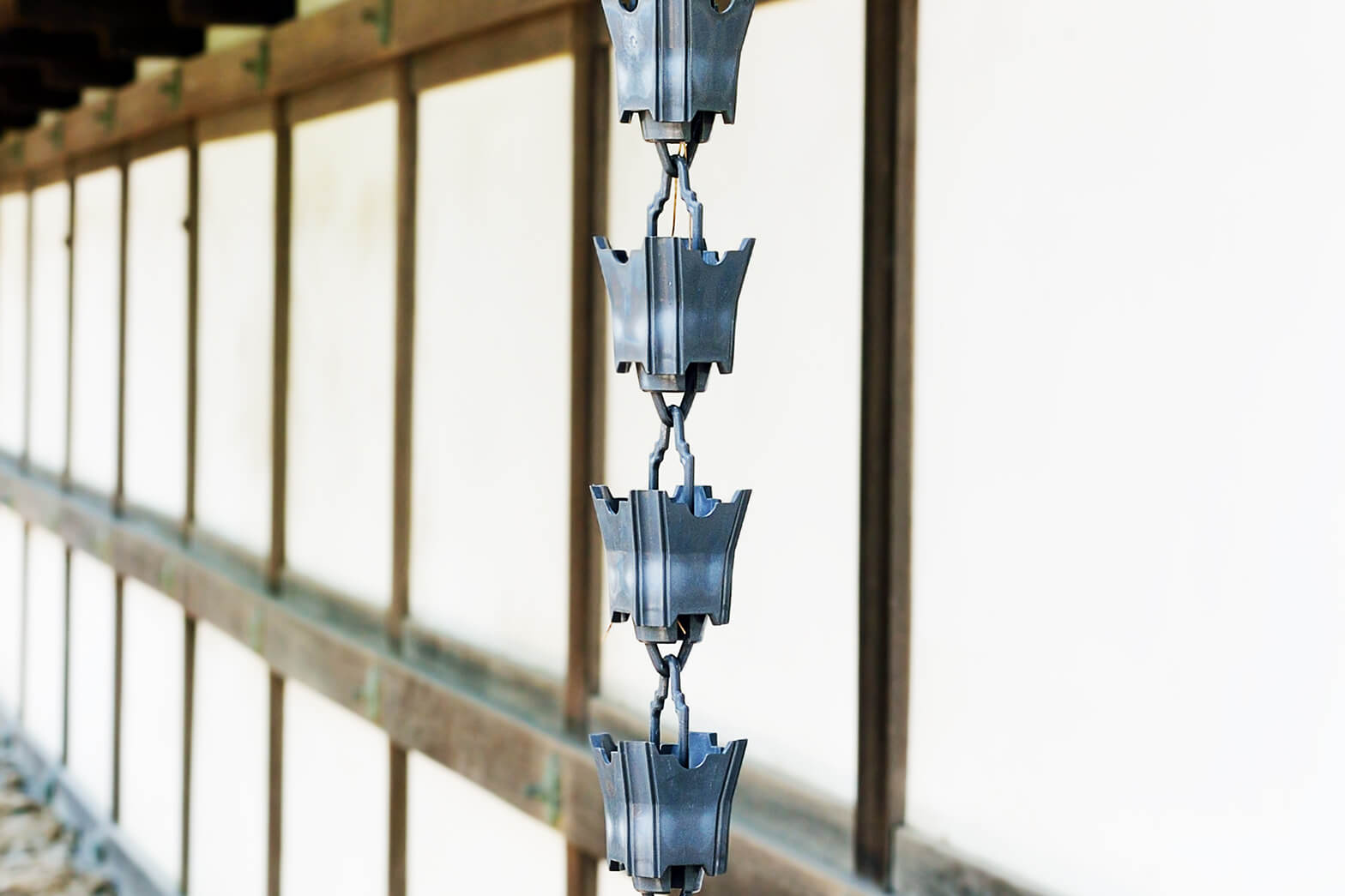 Close up of iron rain chain.
